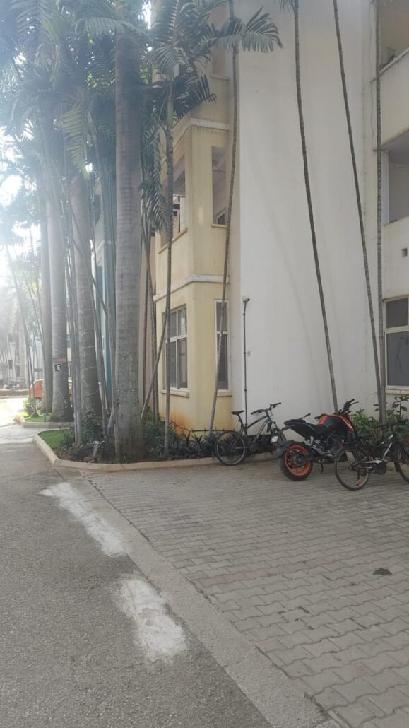 Outdoor bullet camera mounted on an apartment exterior wall