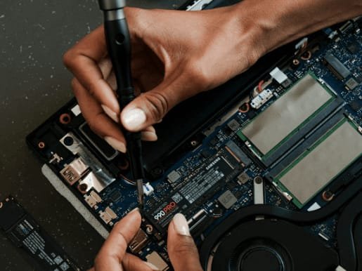 Chip-level laptop motherboard repair in progress at Cadlinc Infotech Bangalore workshop